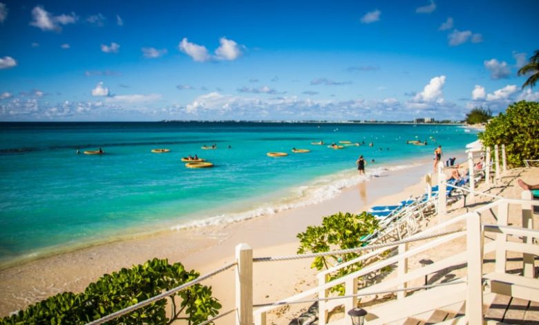 Caymand Islands beach resort with white sand and teal water.