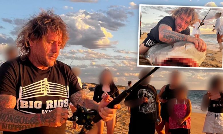 Photo of Infamous Mongolian bikie Troy Mercanti photographed catching a shark off the beach in WA