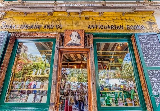 Historic entrance of Shakespeare and Company bookstore in Paris, showcasing its antiquarian charm